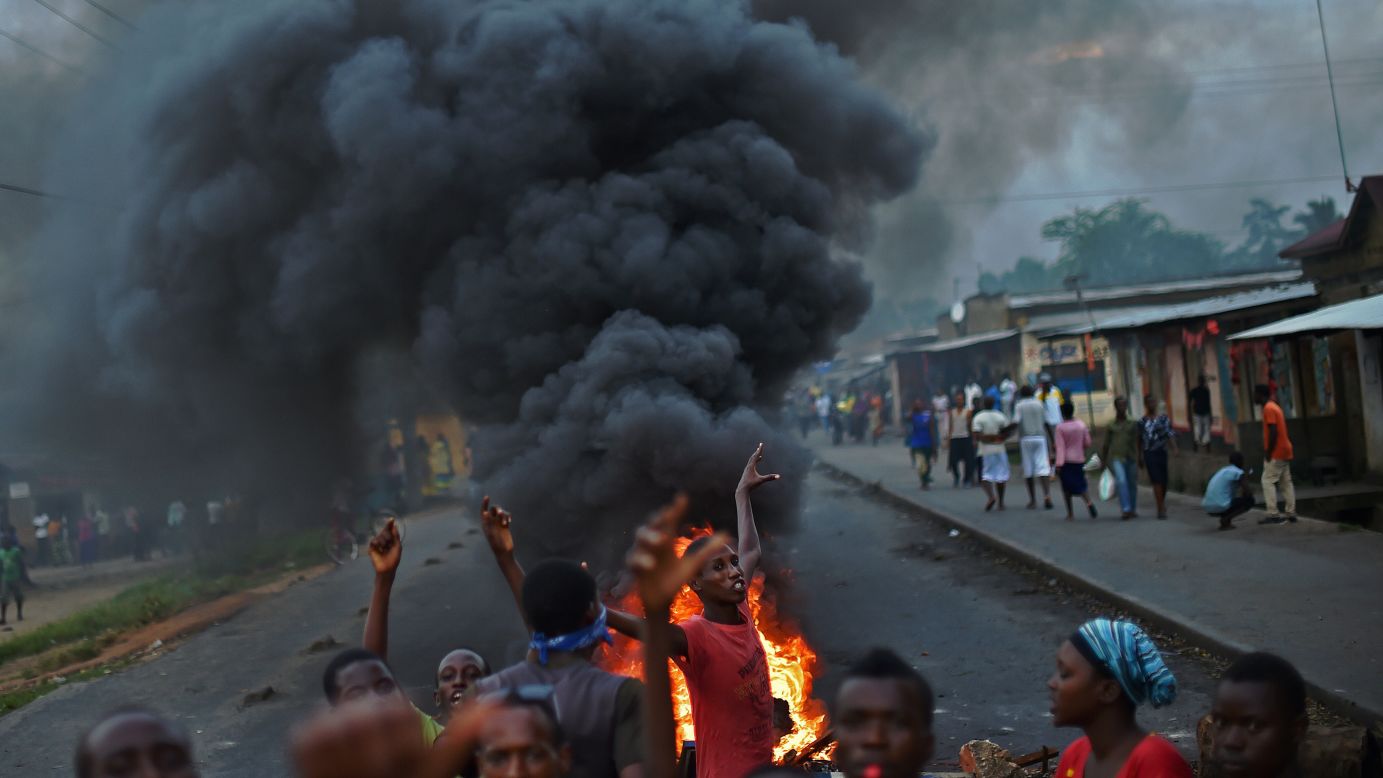 Protesters gather by a burning barricade in Bujumbura, Burundi, on Tuesday, May 19. Animosity against President Pierre Nkurunziza <a href="http://www.cnn.com/2015/05/14/world/gallery/burundi-unrest/index.html" target="_blank">boiled over last month</a> when he expressed his intention to run for a third term.