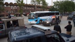 In this photograph taken on May 19, 2015, Pakistani security personnel escort buses carrying Zimbabwe and Pakistani cricket teams as they leave after attending a practice session at The Gaddafi Cricket Stadium in Lahore. Bemused players said they hoped to take the focus off security and put it back on cricket after authorities mounted an unprecedented operation to guard insurgency-hit Pakistan's first home international in six years. Thousands of police and paramilitaries have been deployed and helicopters will be buzzing over Lahore's Gaddafi Stadium, which has been turned into a fortress for the first Twenty20 game against lowly Zimbabwe on May 22. AFP PHOTO/ Aamir QURESHIAAMIR QURESHI/AFP/Getty Images