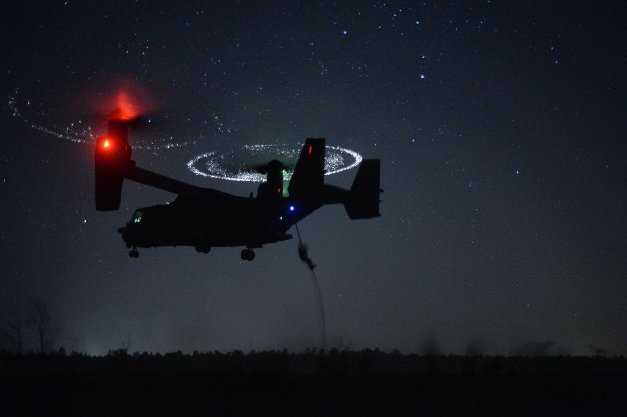 Combat controllers from the 21st Special Tactics Squadron fast-rope from a CV-22 Osprey during Emerald Warrior near Hurlburt Field, Florida, on April 21, 2015. Emerald Warrior is the Department of Defense's only irregular warfare exercise, allowing joint and combined partners to train together and prepare for real-world contingency operations.
