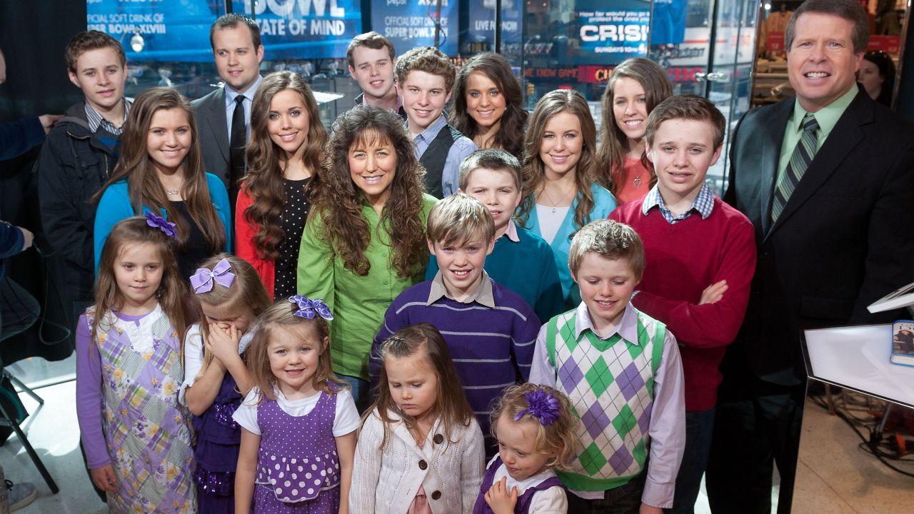 The Duggar family, stars of the now-canceled TLC show "19 Kids and Counting," visits "Extra" at its New York studios in March 2014.