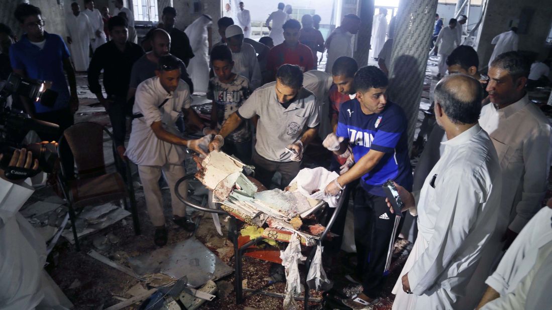 People search through debris after an explosion at a Shiite mosque in Qatif, Saudi Arabia, on Friday, May 22. ISIS <a href="http://edition.cnn.com/2015/05/22/middleeast/saudi-arabia-mosque-blast/