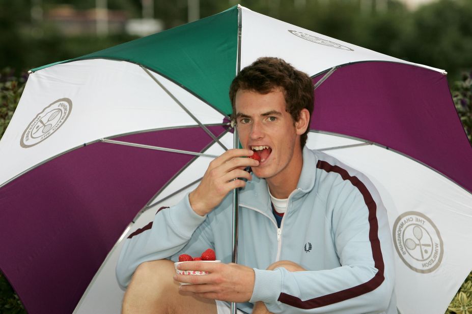 A young Andy Murray tries a taste of some traditional Wimbledon strawberries in 2005.