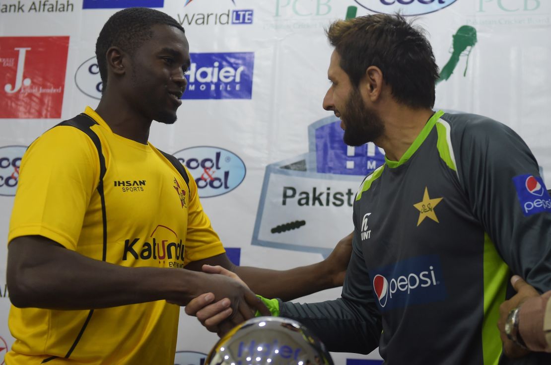 Pakistan's Twenty20 cricket captain Shahid Afridi (R) and his Zimbabwe counterpart Elton Chigumbura shake hands after unveiling the Twenty20 International trophy in Lahore on May 21.