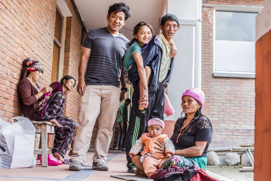 Jwalant Gurung (in tan pants) ran into Maya and her father and brought them back to Kathmandu for care. On the floor are Maya's mother and sister.