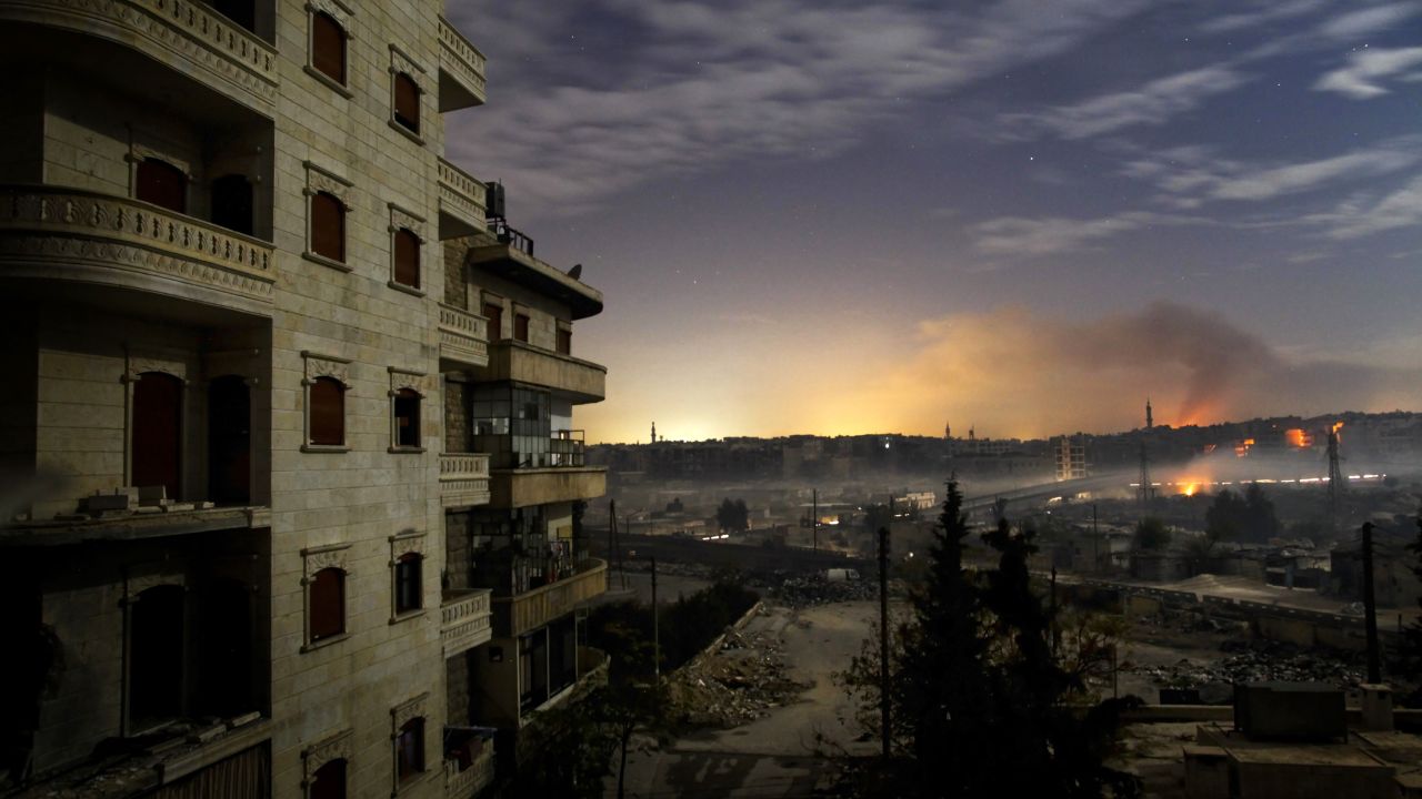 Smoke rises in the Hanano and Bustan al-Basha districts in Aleppo as fighting continues through the night on December 1, 2012.
