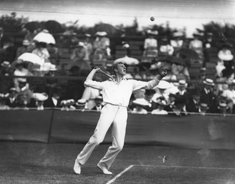 Tony Wilding of New Zealand serves during the 1908 Wimbledon Championships, played at the club's original Worple Road home. 