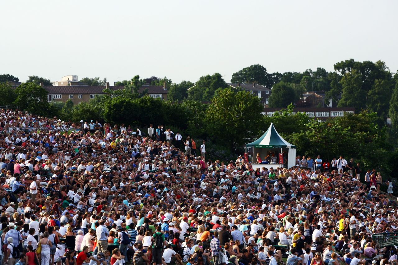 Fans gather near giant screens on "Murray Mount" as their hero takes on Stan Wawrinka of Switzerland in a fourth round match in 2009.