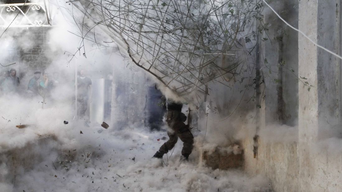 A Free Syrian Army fighter fires a rocket-propelled grenade during heavy clashes in Aleppo on April 27, 2014.