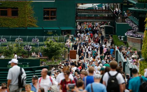 Fans throng pathways at the All England Club on day one of the 2014 tournament.