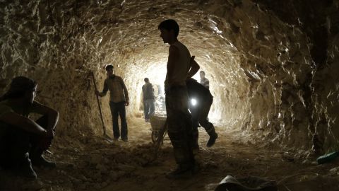 Rebel fighters dig caves in the mountains for bomb shelters in the northern countryside of Hama on March 9, 2015.