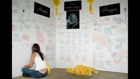 A friend of Natalee Holloway signs a "wall of hope" erected in the weeks after the Alabama teen went missing. Media from all around the world covered Holloway's disappearance. 