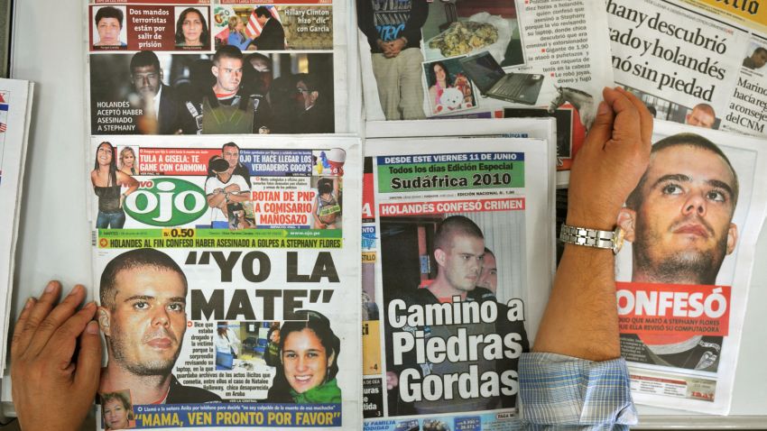 A man displays Peruvian newspapers with front pages allusive to the murder of 21-year-old Peruvian Stephany Flores by Dutch Joran Van der Sloot, on June 8, 2010 in Lima. Van der Sloot, 22, confessed having murdered  Flores last May 30, after which the Peruvian authorities are expected to conduct a reenactment of the murder tonight. The case brings up an earlier instance also in the disappearance of US citizen Natalee Holloway in Aruba on May 30, 2005 when Van der Sloot was acquitted for lack of proofs. 