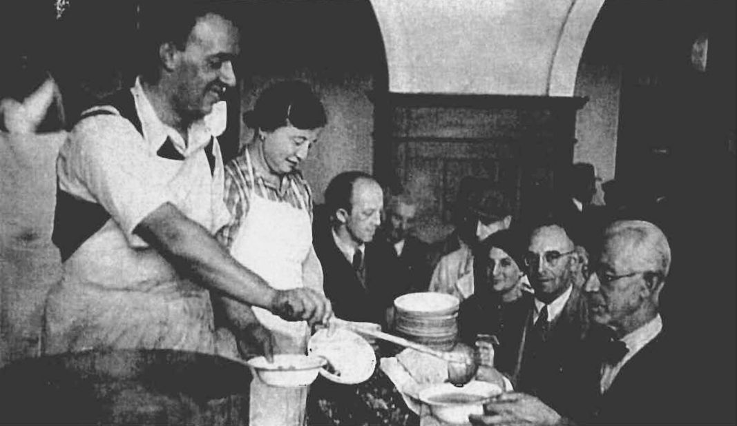 Food being served for Jewish refugees that had just arrived Shanghai.  Many Jewish charity organizations provided aid to the refugees to help them survive.