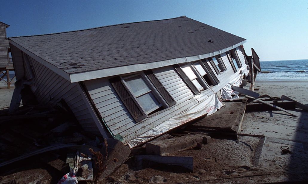 <strong>Floyd, 1999: </strong>Deadly flooding, especially in North Carolina, was one of Floyd's main legacies. Parts of eastern North Carolina and Virginia received 15 to 20 inches of rain, and flooding led to the razing of thousands of buildings -- most of them homes -- from North Carolina to New Jersey.  At the time, it was the deadliest U.S. hurricane since 1972. Here,a beach house, severely damaged by Floyd, sits crumbled sits in the sand on the Oak Island town of Long Beach, North Carolina, on November 10.