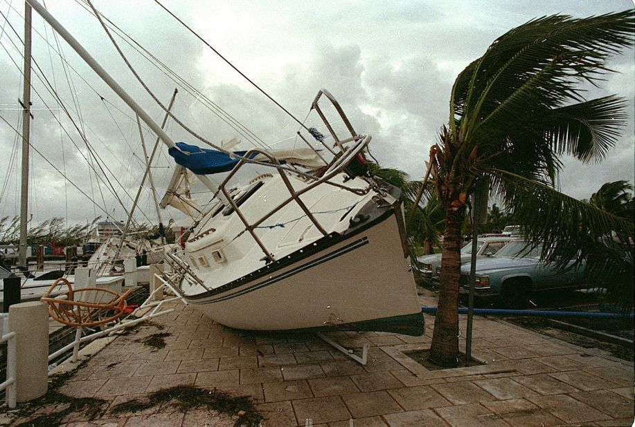 <strong>Andrew, 1992</strong>: <a href="http://www.srh.noaa.gov/mfl/?n=andrew" target="_blank" target="_blank">Andrew</a> blasted its way across south Florida on August 24 as a Category 4 with peak gusts measured at 164 mph. After raking entire neighborhoods in an around Homestead, it moved across the Gulf to hit Louisiana as a Category 3. It was responsible for 23 U.S. deaths and three in the Bahamas. Here, a sailboat sits on a sidewalk at Dinner Key in Miami after Andrew washed it ashore.