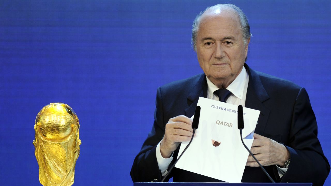Outgoing FIFA President Sepp Blatter holds up the name of Qatar during the official announcement of the 2022 World Cup host country on December 2, 2010  at the FIFA headquarters  in Zurich. 