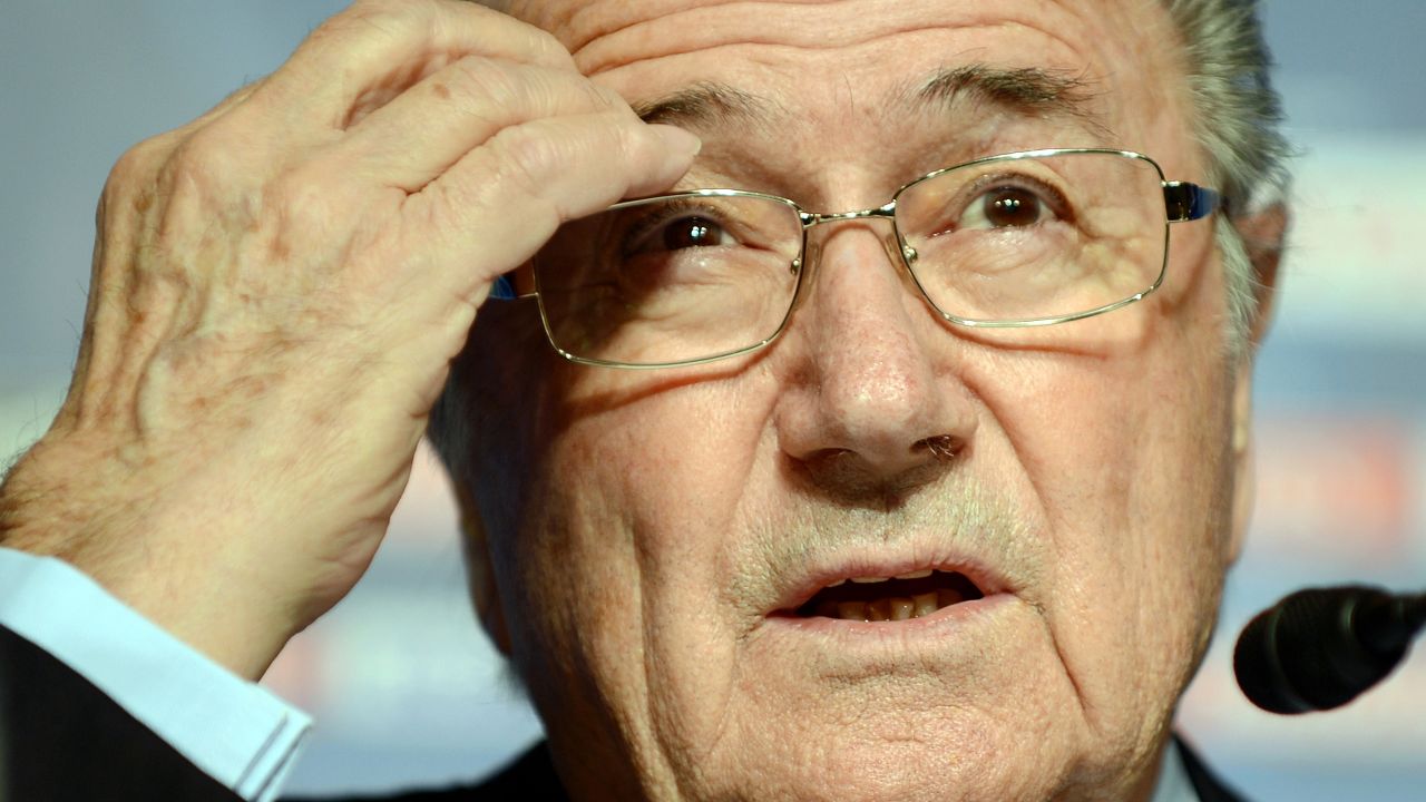 FIFA president Joseph Blatter gestures as he answers questions during a press conference in Tokyo on December 15, 2012, one day before the 2012 Club World Cup final football match. The world football organization held a press conference following the executive committee.      AFP PHOTO/Toru YAMANAKA        (Photo credit should read TORU YAMANAKA/AFP/Getty Images)