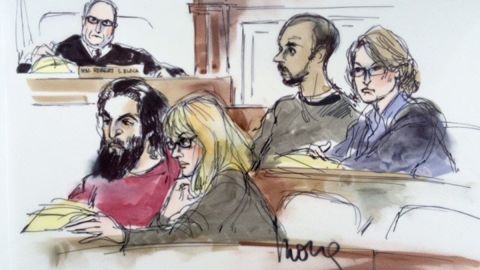 In the courtroom on Friday are defendant Nader Elhuzayel (in red, at left) with his attorney and defendant Muhanad Badawi (in gray shirt, center right) with his attorney Kate Corrigan. Magistrate judge is Robert Block.