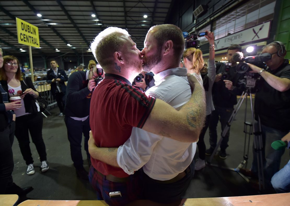 Gay couple Michael Barron and Jamie Nanci kiss during the referendum vote on same-sex marriage in 2015. 