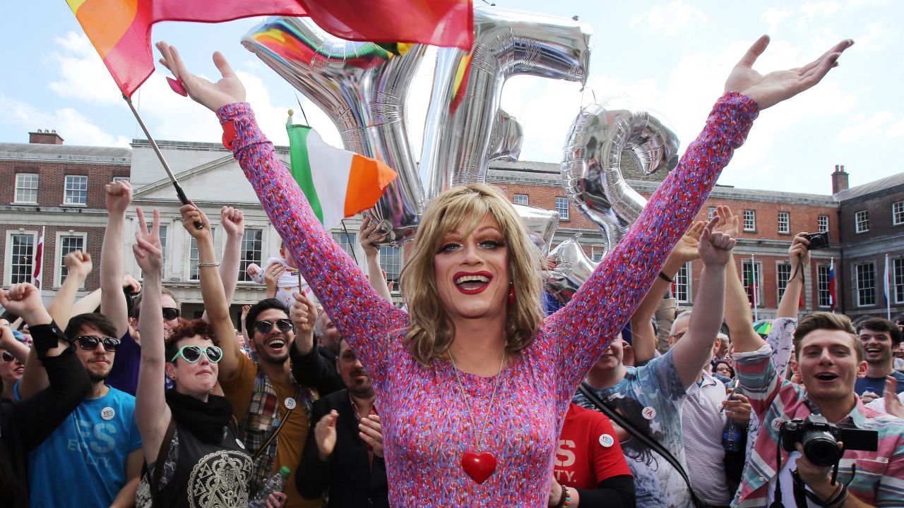 Drag queen and gay rights activist Rory O'Neill, also known by the stage name Panti, raises her arms with supporters for same-sex marriage at Dublin Castle on Saturday, May 23. 