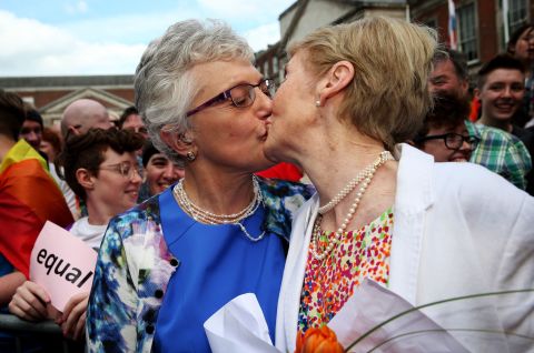 Sen. Katherine Zappone kisses Ann Louise Gilligan on Saturday, May 23, at the central count station at Dublin Castle, Dublin, after Zappone proposed live on televison. By a solid majority, Ireland became the first country in the world to legalize same-sex marriage by popular vote.