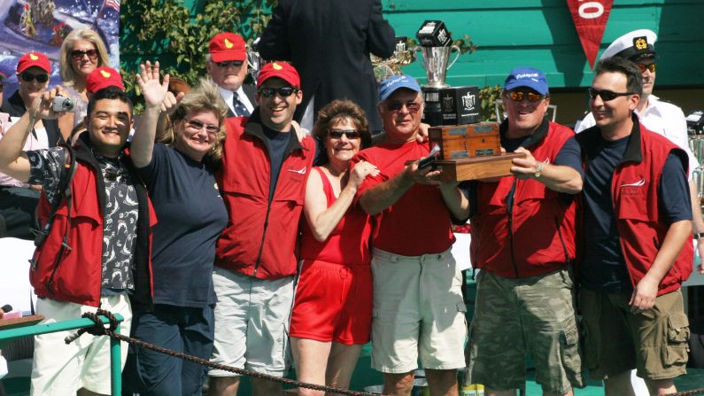 Corinthian sailors are amateurs whose love of sea and sail is demonstrated by racing in regattas year after year as essentially a hobby. John Szalay (wearing a blue cap and the light-colored shorts) is retiring after competing for 51 consecutive years in the Newport to Ensenada International Yacht Race. Here the 79-year-old hoists a trophy with his crew after finishing first in class in the 2006 race.