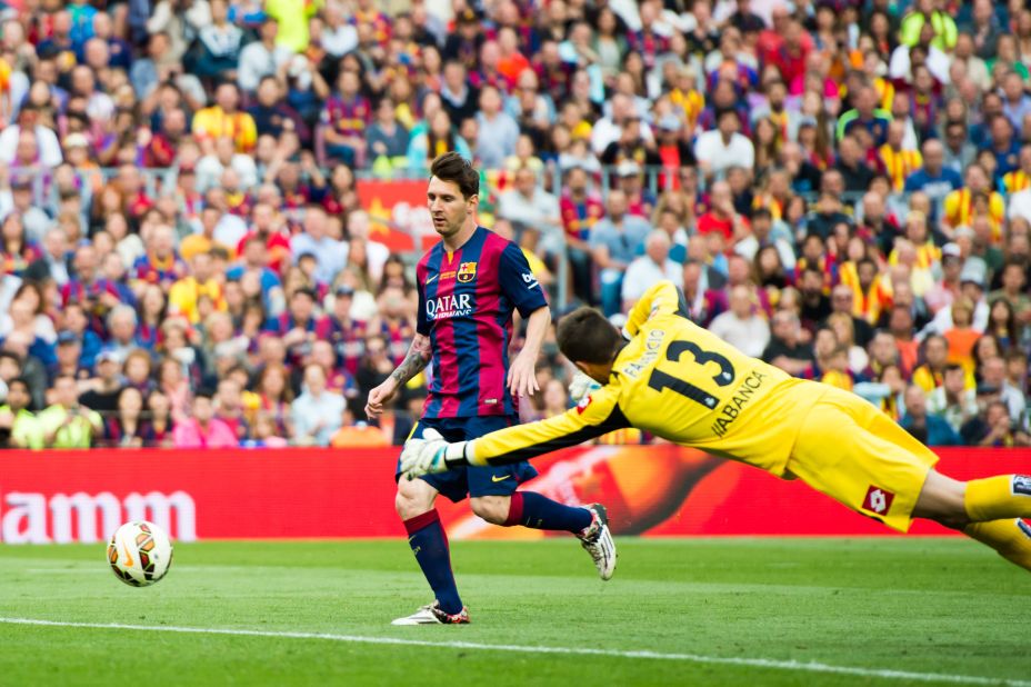Messi scores his second goal in Barcelona's 2-2 draw with Deportivo La Coruna, taking his season tally to 56.