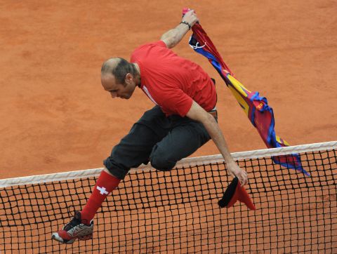 The spectator, wearing Swiss regalia, leaped the net to get near Federer in that final. 