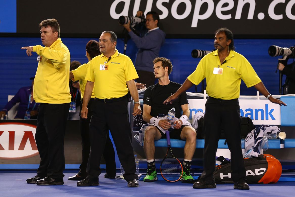 The 2015 Australian Open men's final was held up for several minutes by protesters. Here security staff surround Andy Murray, who was beaten in the final by Novak Djokovic.