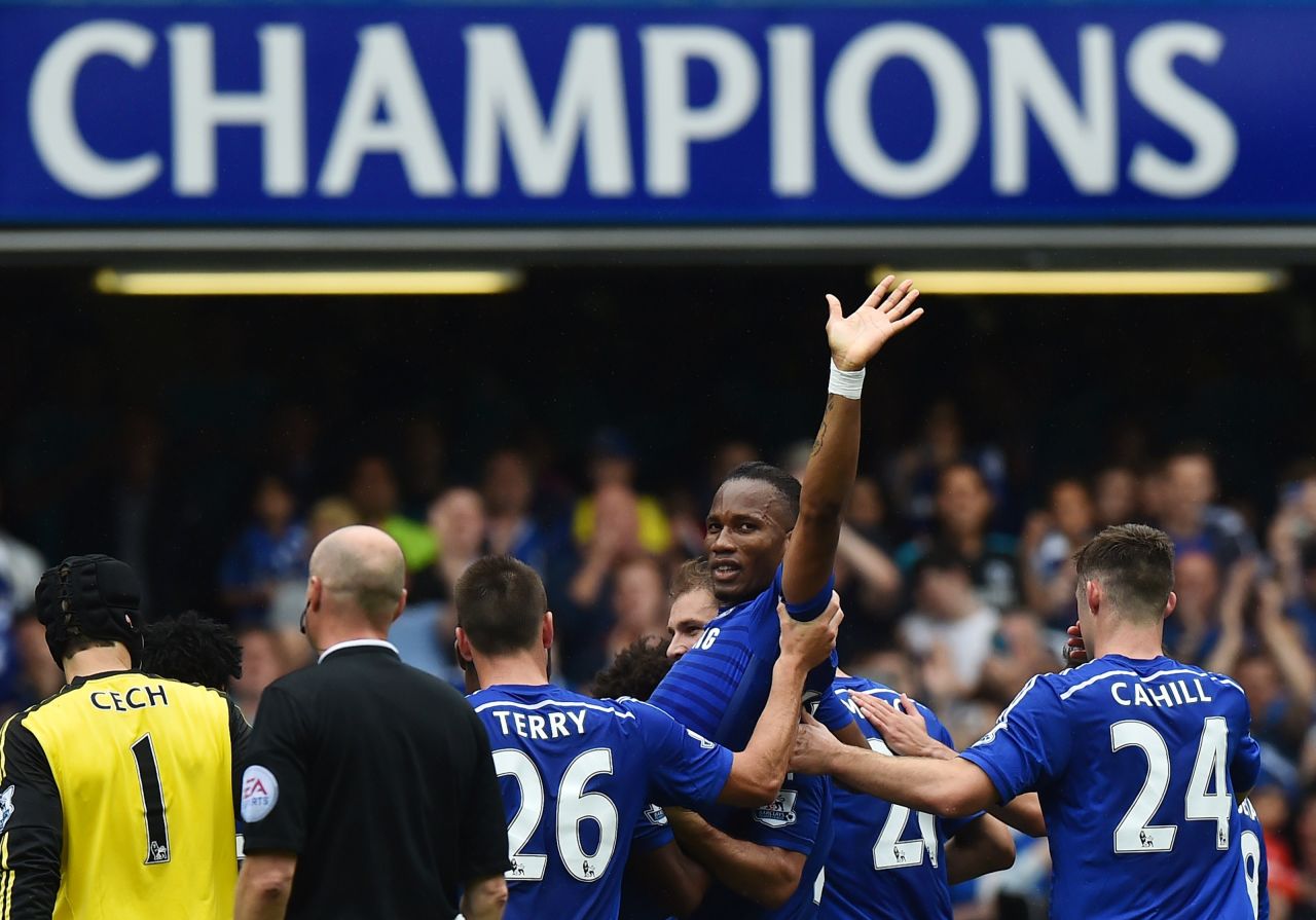 Chelsea striker Didier Drogba waves goodbye to fans as he is carried off by teammates during the 3-1 win over Sunderland on the final day of the English Premier League season.