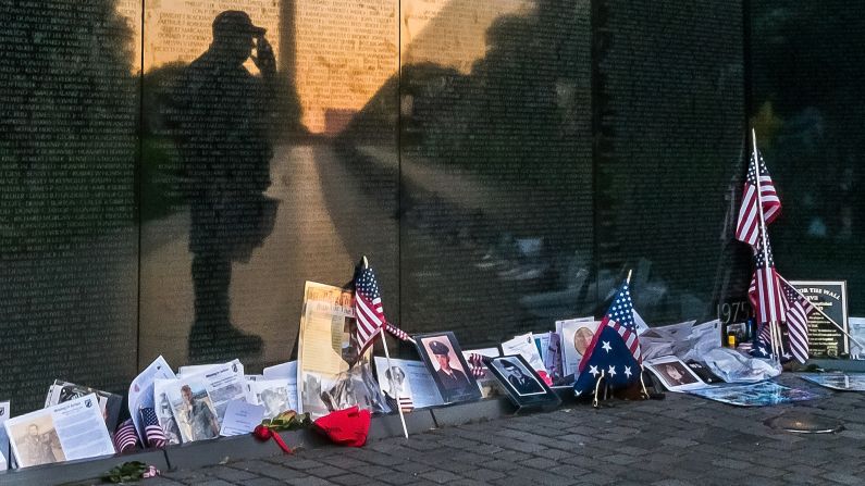 Army veteran Bernie Klemanek stops to salute his fallen comrades during an early morning visit to the Vietnam Veterans Memorial in Washington on May 25.