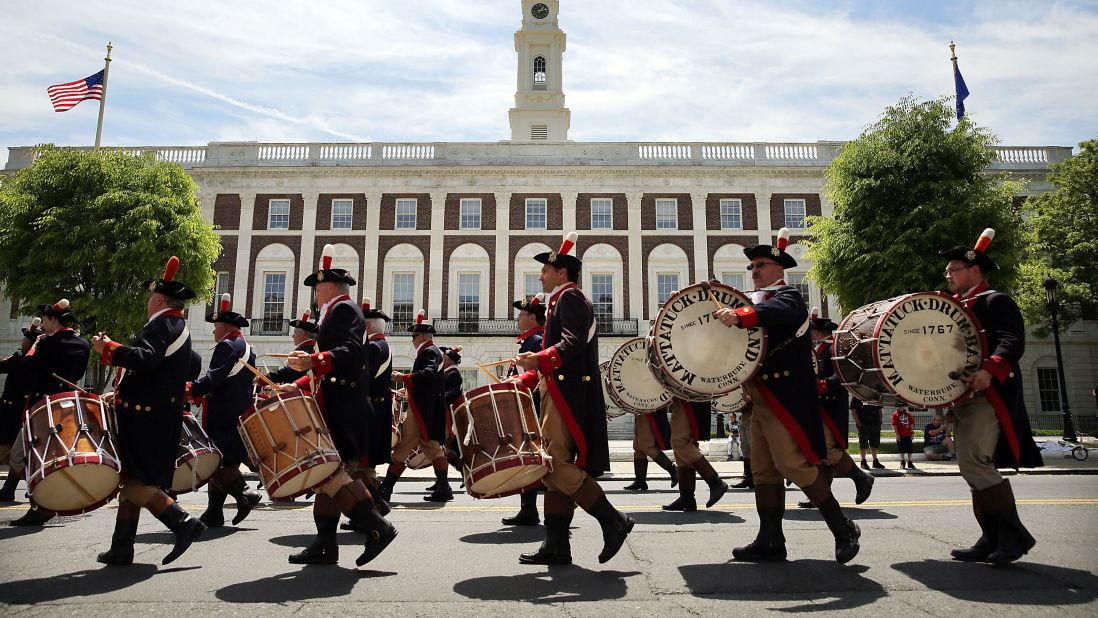 Marchers play drums during the Memorial Day Parade in Waterbury on May 24.