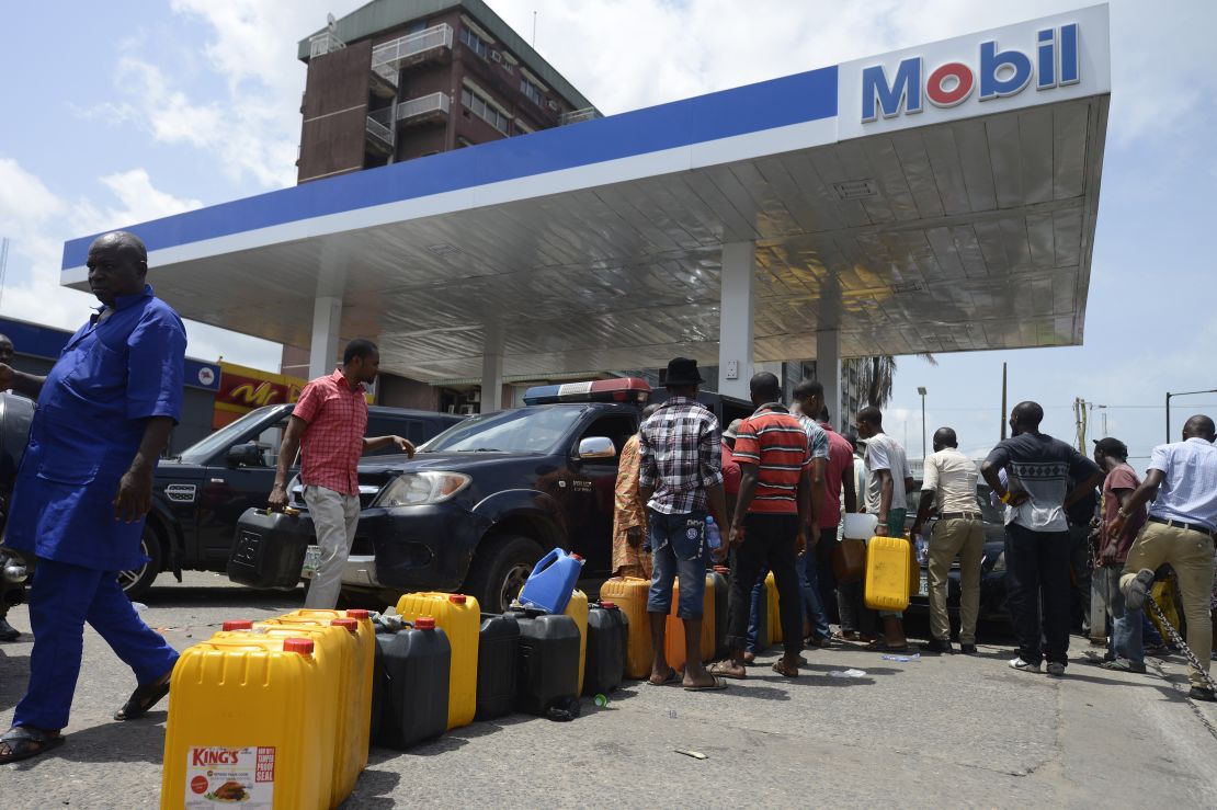 People line up to buy fuel last week at a Mobil gas station in Lagos, Nigeria.
