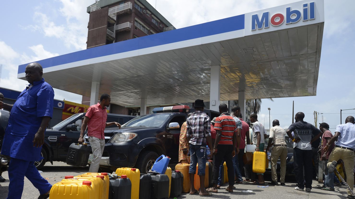 People line up to buy fuel last week at Mobil gas station in Lagos, Nigeria.