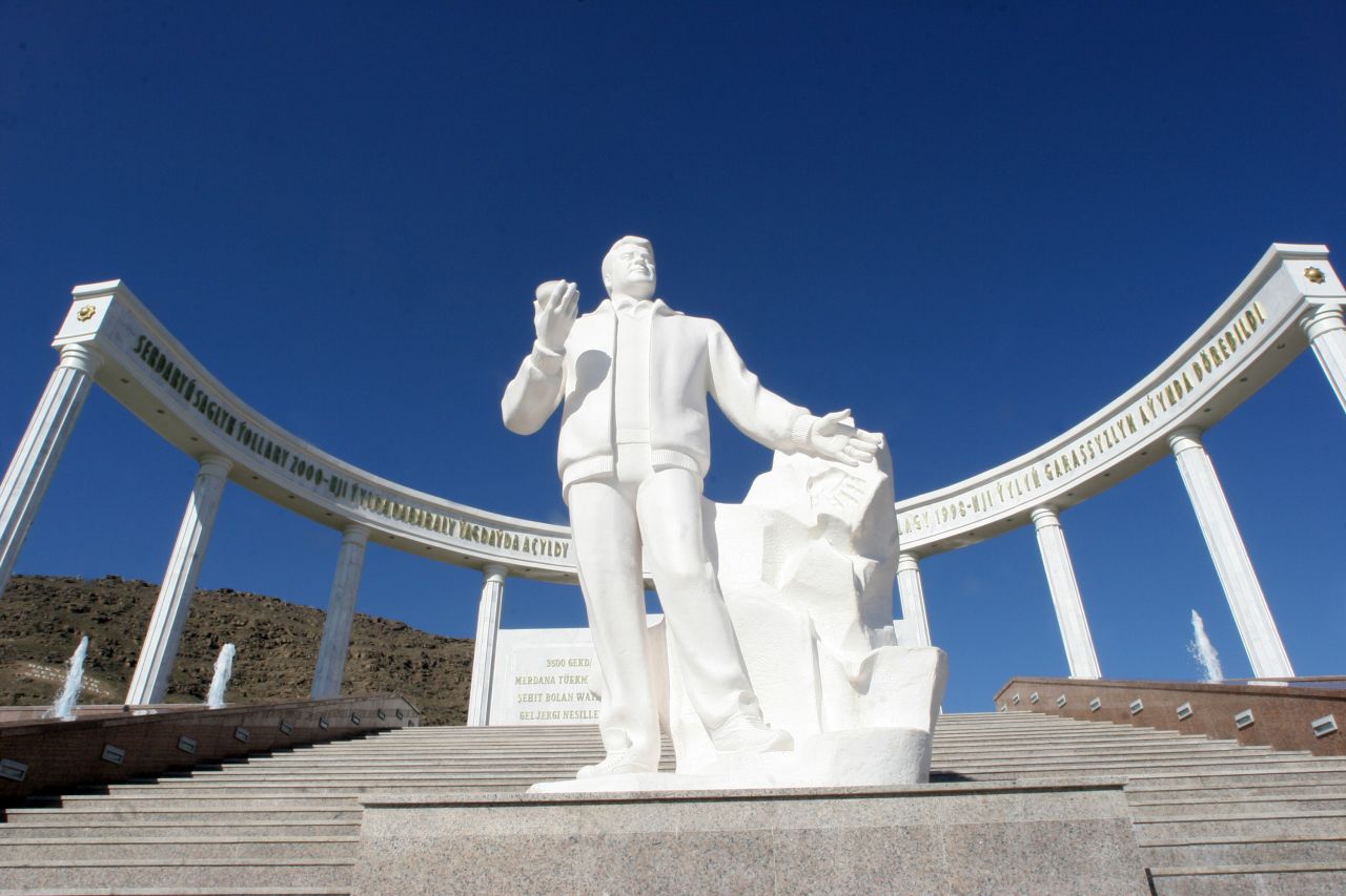 As well as burning gas craters, Turkmenistan has statues -- lots of them. This one is of Turkmenistan's former President Saparmurat Niyazov in front of the earthquake memorial in Ashgabat.