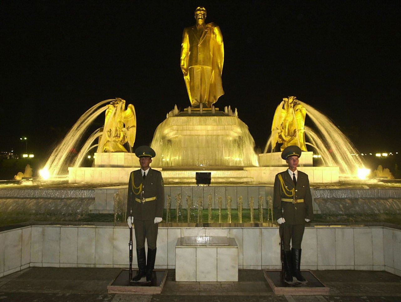 Another statue of Niyazov, with two soldiers standing guard, rises above the country's Independence Monument in Ashgabat. Turkmenistan became independent upon the dissolution of the Soviet Union in 1991.