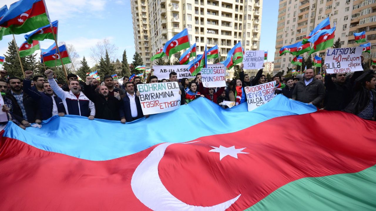 One Azeri journalist told us you have to be a "maniac" to openly demonstrate in Azerbaijan -- yet protests do take place. These opposition supporters campaigned on the streets in April 2015.