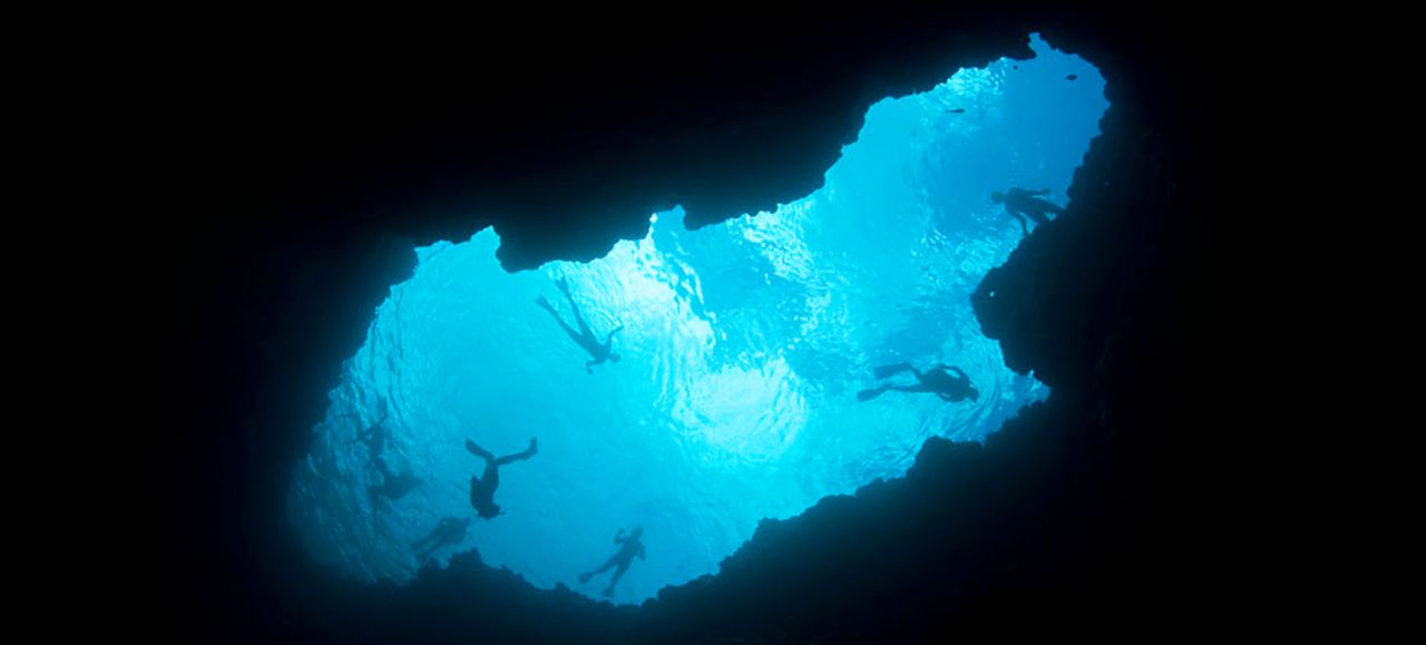 Snorkelers love hovering above a "blue hole" in a Palau reef.