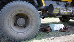 An Indian man rests under a transport vehicle on the outskirts of Hyderabad on May 25, 2015. More than 430 people have died in two Indian states from a days-long heatwave that has seen temperatures nudging 50 degrees Celsius (122 degrees Fahrenheit), officials said May 25. Officials warned the toll was almost certain to rise, with figures still being collected in some parts of the hard-hit Telangana state in the south of the country, and with no end in sight to the searing conditions. AFPHOTO/ Noah SEELAMNOAH SEELAM/AFP/Getty Images
