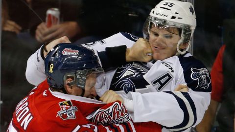 Oshawa's Michael McCarron, left, fights Rimouski's Samuel Morin during a Memorial Cup game in Quebec City on Saturday, May 23.