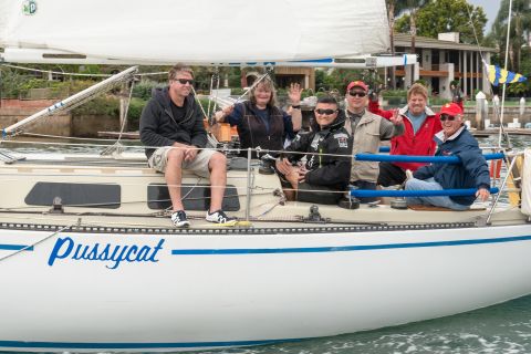 John Szalay and his crew aboard the skipper's 34-foot-long Peterson sloop.