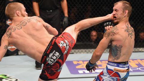 Justin Scoggins kicks Joshua Sampo during their flyweight bout at UFC 187 on Saturday, May 23. Scoggins won by unanimous decision.