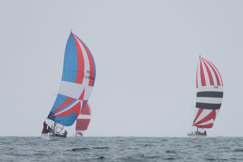 This year's Newport to Ensenada International Yacht Race was marked by rogue showers -- but not enough to reign in the spinnakers of these racing sailboats.