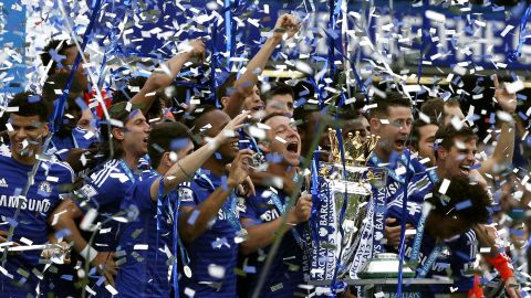 Chelsea captain John Terry holds the Premier League trophy as he and his teammates celebrate their title-winning season Sunday, May 24, in London. The soccer club actually clinched the title on May 3.