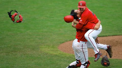 St. John's catcher Tyler Sanchez, left, hugs pitcher Ryan McCormick after they defeated Creighton to win the Big East baseball tournament on Sunday, May 24.