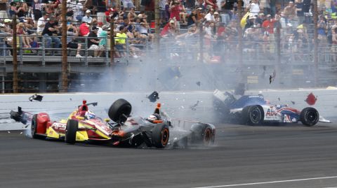 Stefano Coletti, center, hits the car driven by Sebastian Saavedra, left, during the closing laps of the Indianapolis 500 on Sunday, May 24. Jack Hawksworth, right, also hit the wall. Saavedra suffered a bruised foot in the wreck. The other two drivers were not injured.
