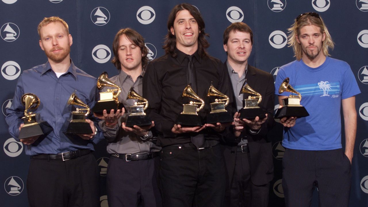 The Foo Fighters pose backstage with their Grammys at the 2001 ceremony.