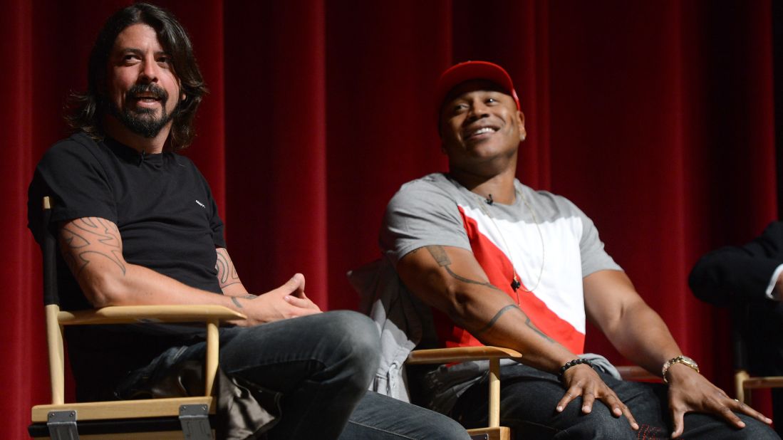 Grohl and LL Cool J speak during the premiere of "A Death In The Family: The Show Must Go On," a documentary about how the Grammys adjusted to Whitney Houston's death, in California in 2012.