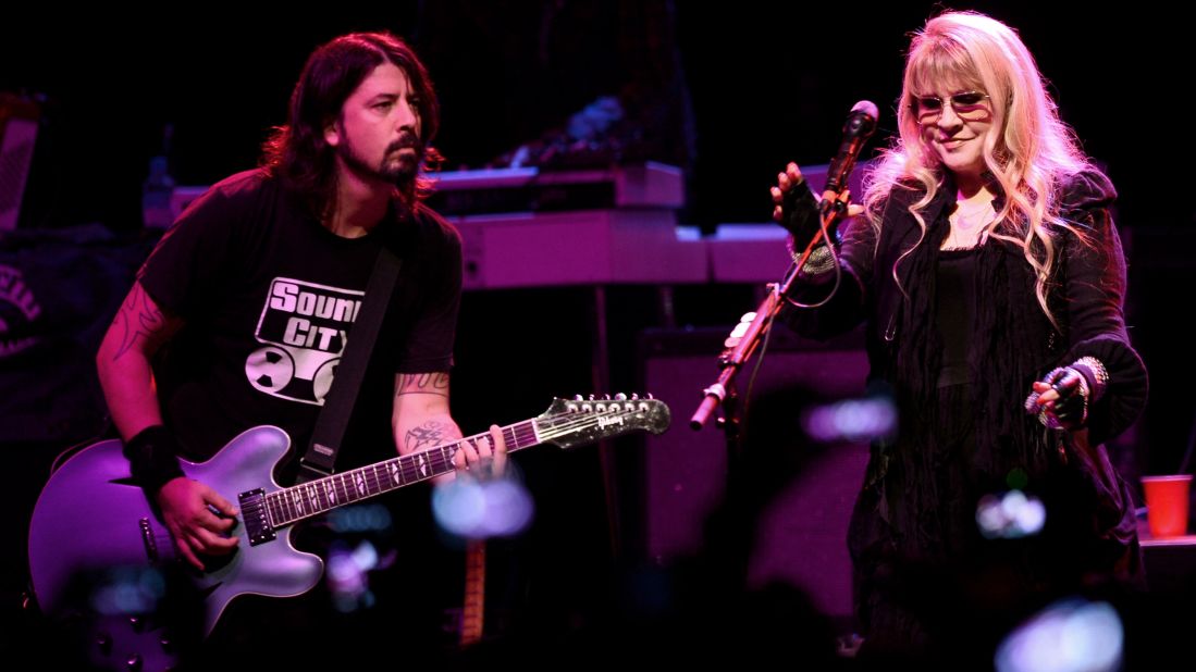 Grohl and Stevie Nicks perform at a concert to celebrate the premiere of his film "Sound City" in 2013 in Los Angeles.