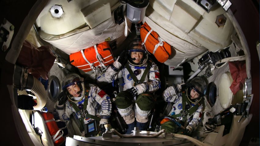 Nie Haisheng, center, Wang Yaping, right,  and Zhang Xiaoguang, left --  the crew of the 2013 Shenzhou-10 mission, China's longest manned spaceflight to date.